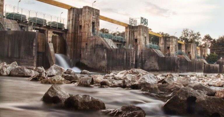 Retention - Flowing Water over Stones behind Dam