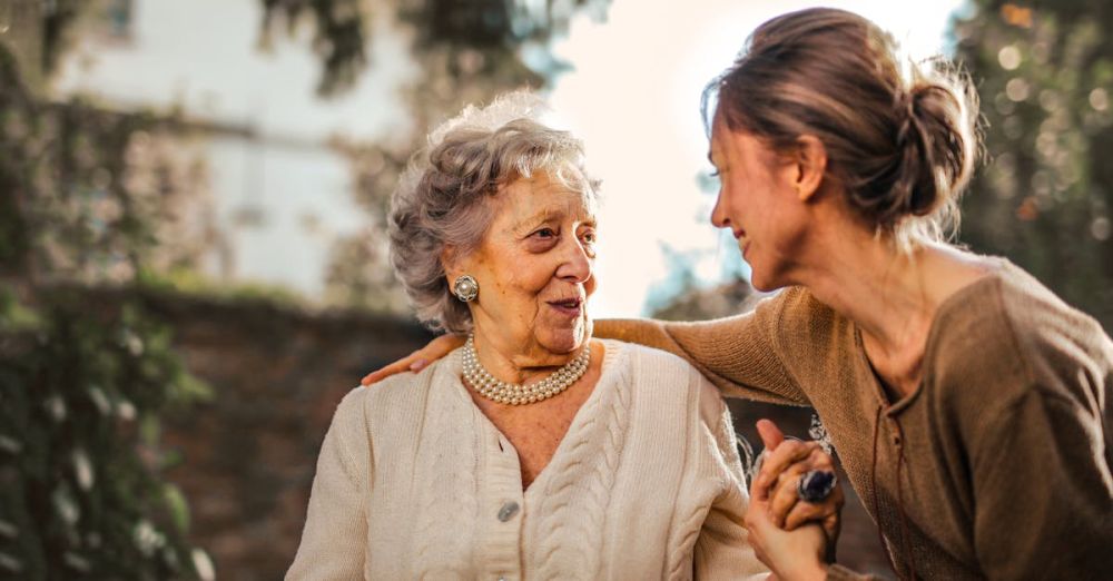 Interactions - Joyful adult daughter greeting happy surprised senior mother in garden