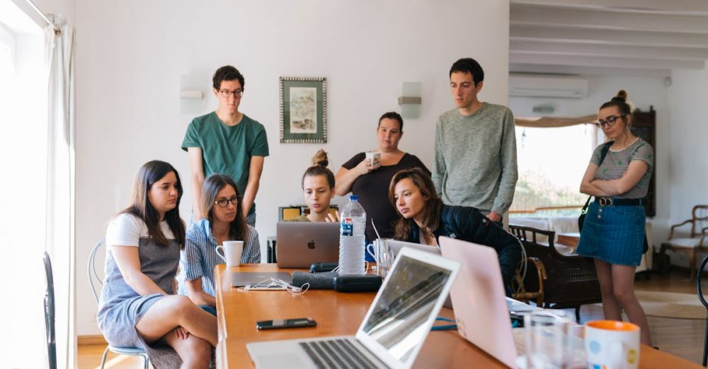 Team - Group of People Watching on Laptop