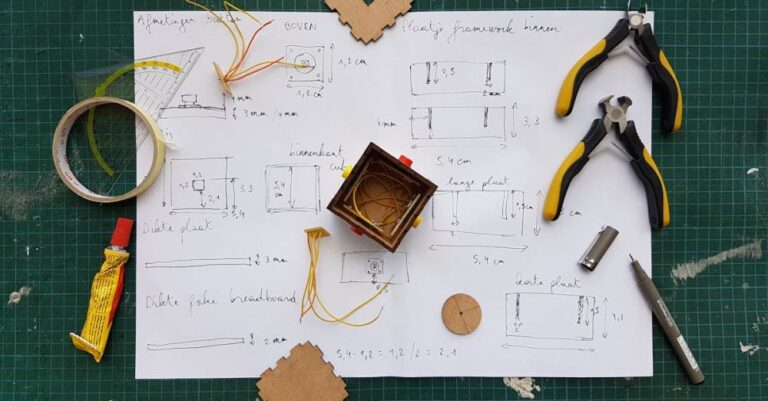 Prototyping - White Diagram Paper Under Pliers