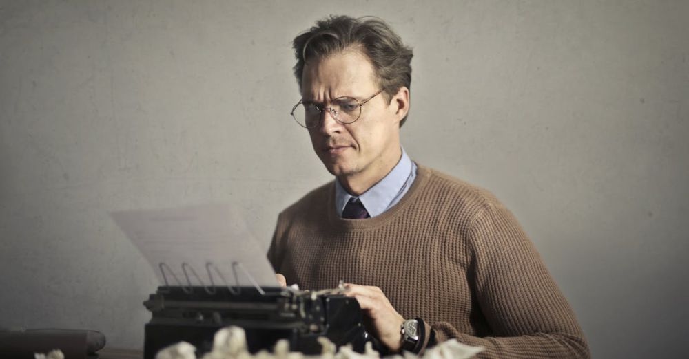 Mistakes - Adult frowned male writer working on typewriter at home